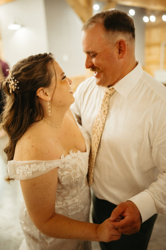 Couple smiling at each other while dancing, close up