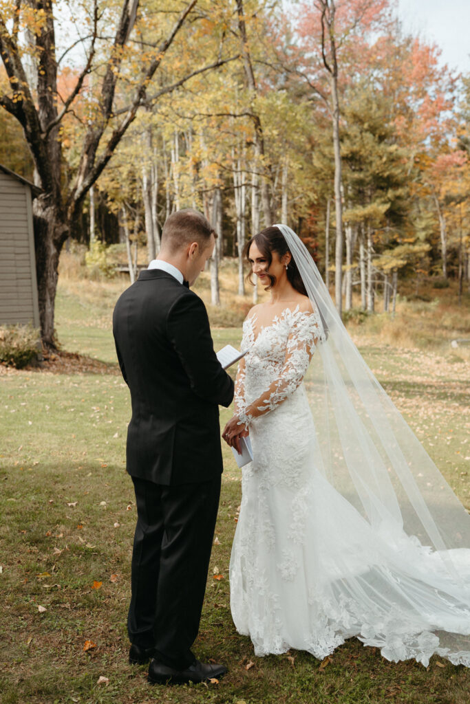 Couple reading notes to each other in the woods