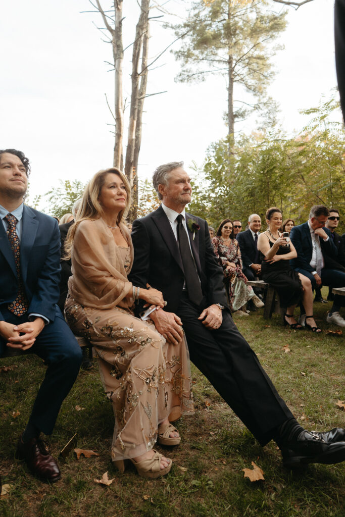 Guests seated on benches during the ceremony