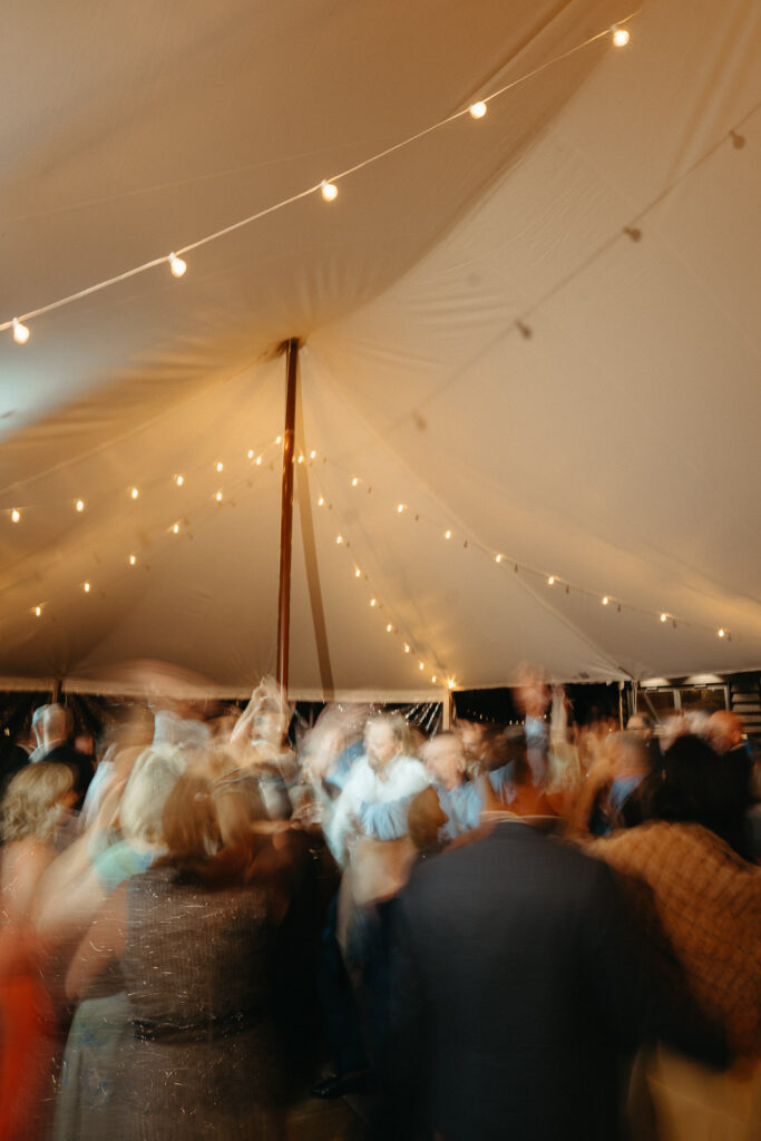 Blurred crowd dancing under the tent