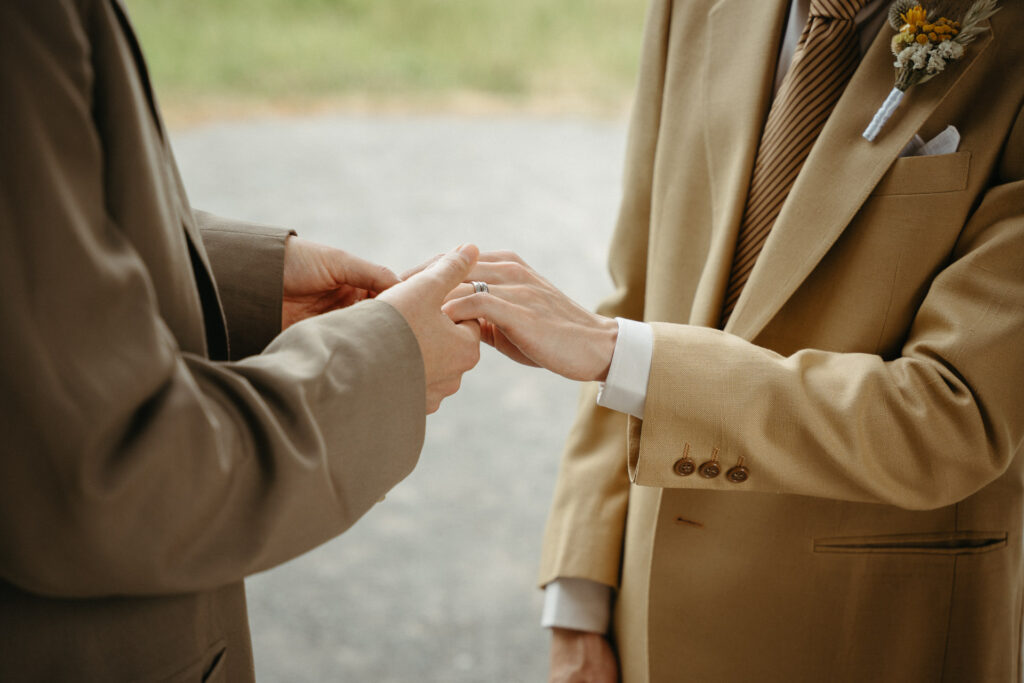 Close-up of a ring being placed on a finger