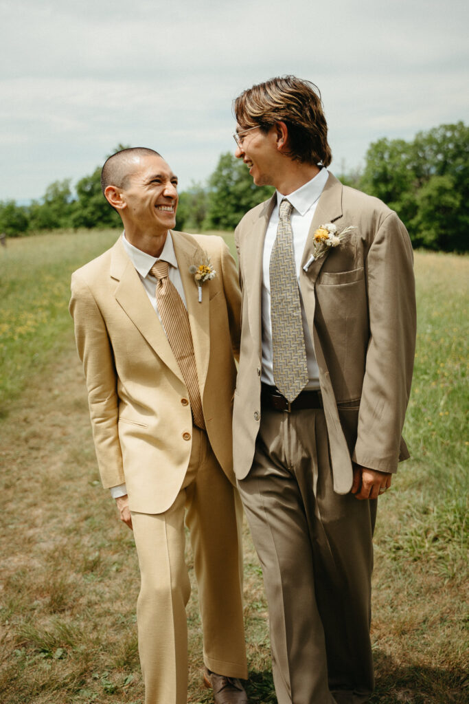 Couple laughing together in the meadow